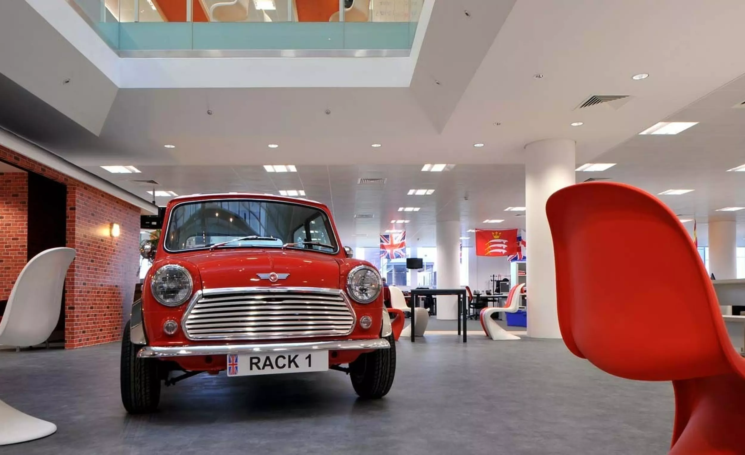 Fun office design with a Mini in the open plan office