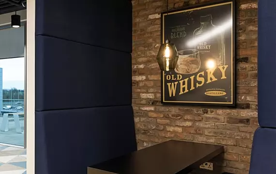 Trendy breakout space with exposed brick design