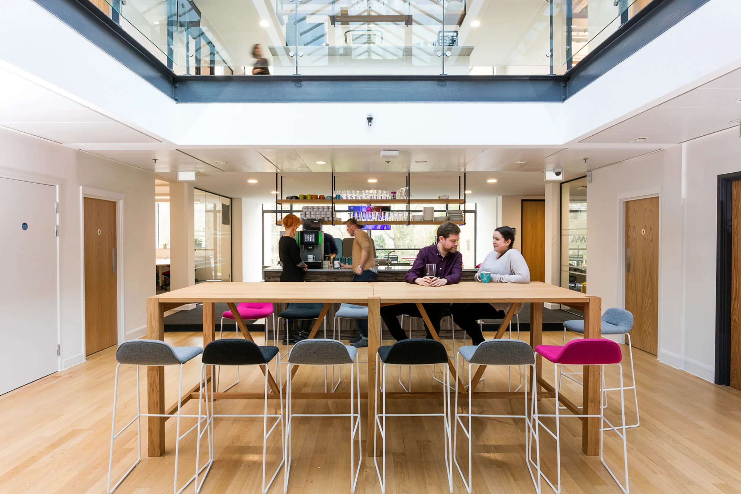 Office design with coffee bar at centre for collaboration